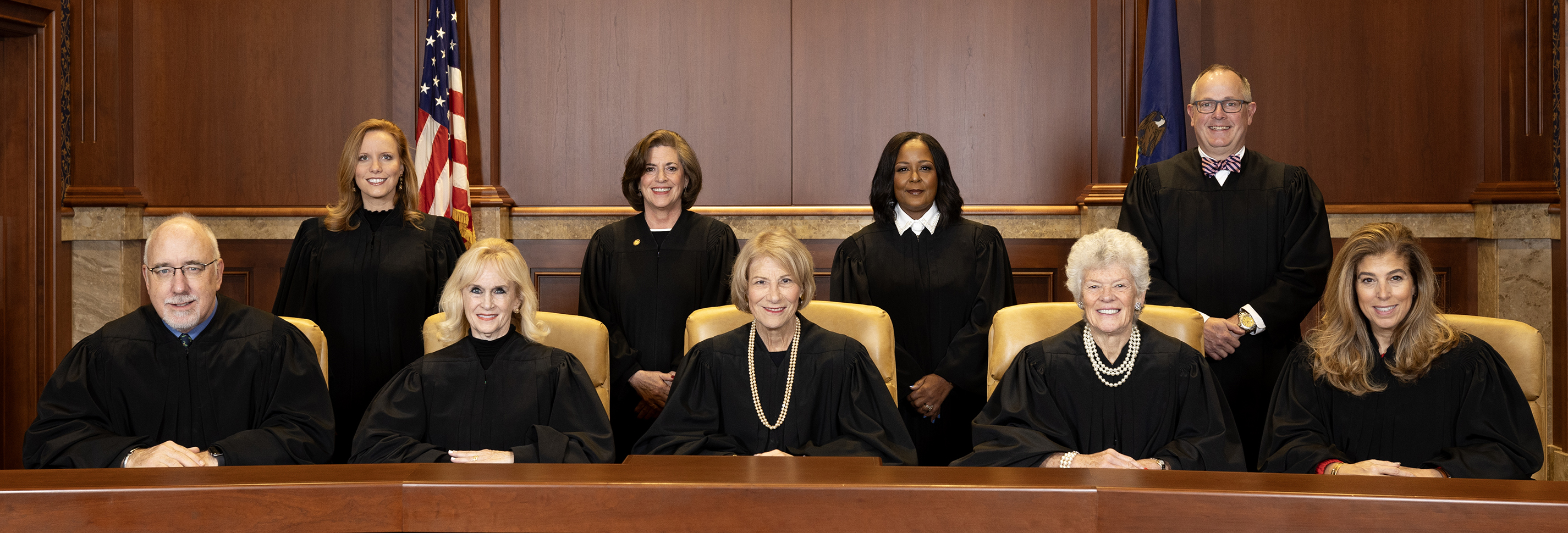 Commonwealth court judges sitting together in a court place.