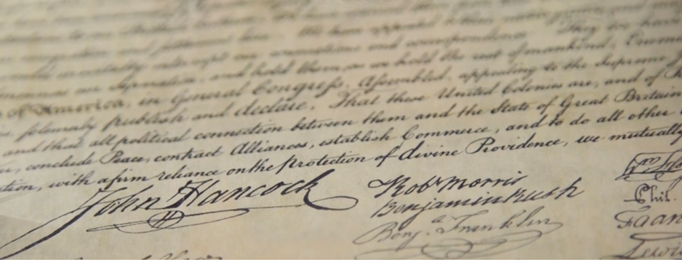 Photo of signatures on the U.S. Constitution.